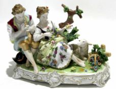 Large Continental porcelain model of a boy and girl as part of a pastoral scene with sheep and