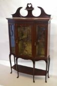 Late Victorian mahogany shaped fronted display cabinet, three glazed doors beneath a fret cut frieze
