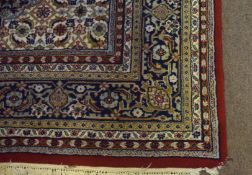 Large modern Caucasian type carpet with central lozenge, predominantly blues and red field with