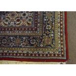 Large modern Caucasian type carpet with central lozenge, predominantly blues and red field with