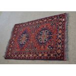 Good quality modern floor rug with rust field and two central geometric lozenges among a floral