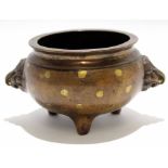 Chinese bronze censer, the handles modelled as lion heads on three stub feet, 10cm diam