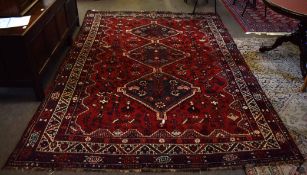 Caucasian wool carpet (manufactured in Iran), central panel of interlinked lozenges on a mainly