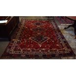 Caucasian wool carpet (manufactured in Iran), central panel of interlinked lozenges on a mainly