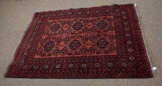 Good quality modern Khal carpet decorated with rust ground and floral and geometric design to