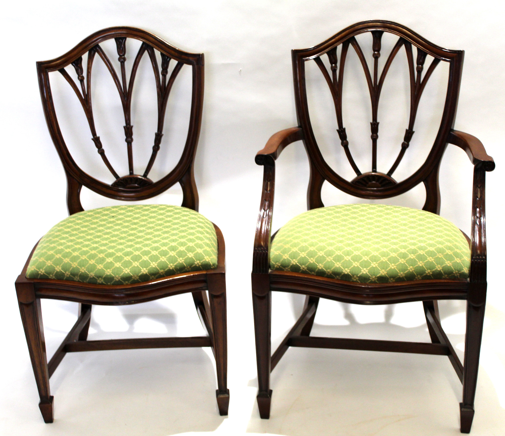 Good quality set of 12 (10+2) Hepplewhite style mahogany dining chairs with triple pierced bar