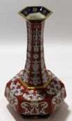 Baluster vase with scrolling design in gilt and blue on a red ground, 31cm high