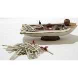 Bag of assorted ivory items including model of a boat, early 20th century, and a number of small