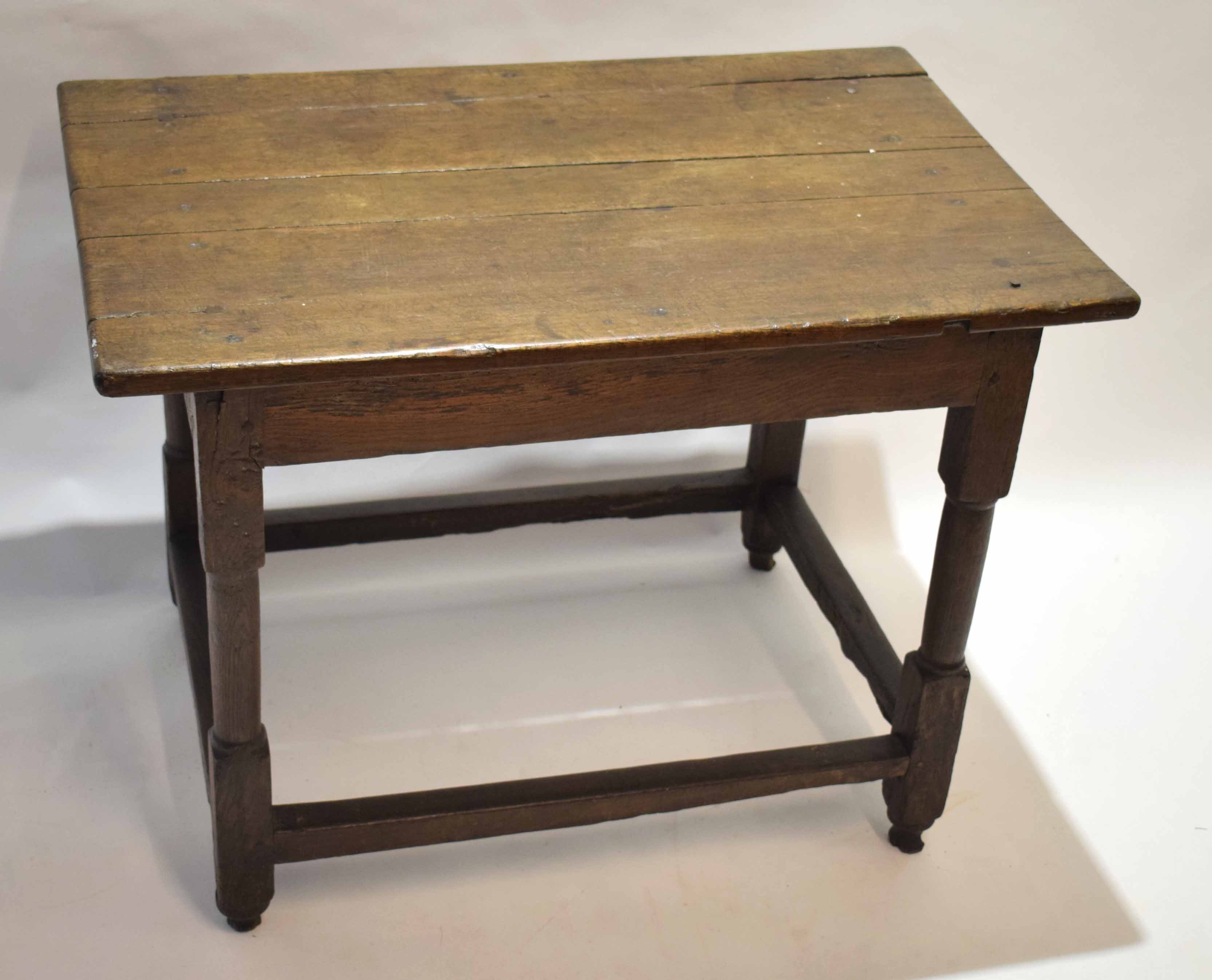17th/18th century and later oak side table, plank top over a plain frieze raised on cylindrical