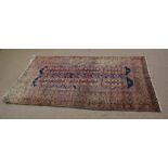 Bokhara type carpet with multi-gulled border with repeating rectangular lozenge centre with inter-