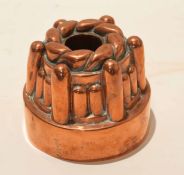 Victorian circular copper jelly or blancmange mould with central opening, the base 13cm diam,