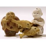 Ivory model of a fish and a small boy, plus a further model of a man with Japanese symbols (3)
