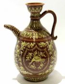 Italian large brown jug with a slip design of birds and foliage, 33cm tall