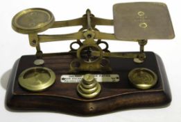 Set of wooden based and brass letter scales with weights, 18cm wide