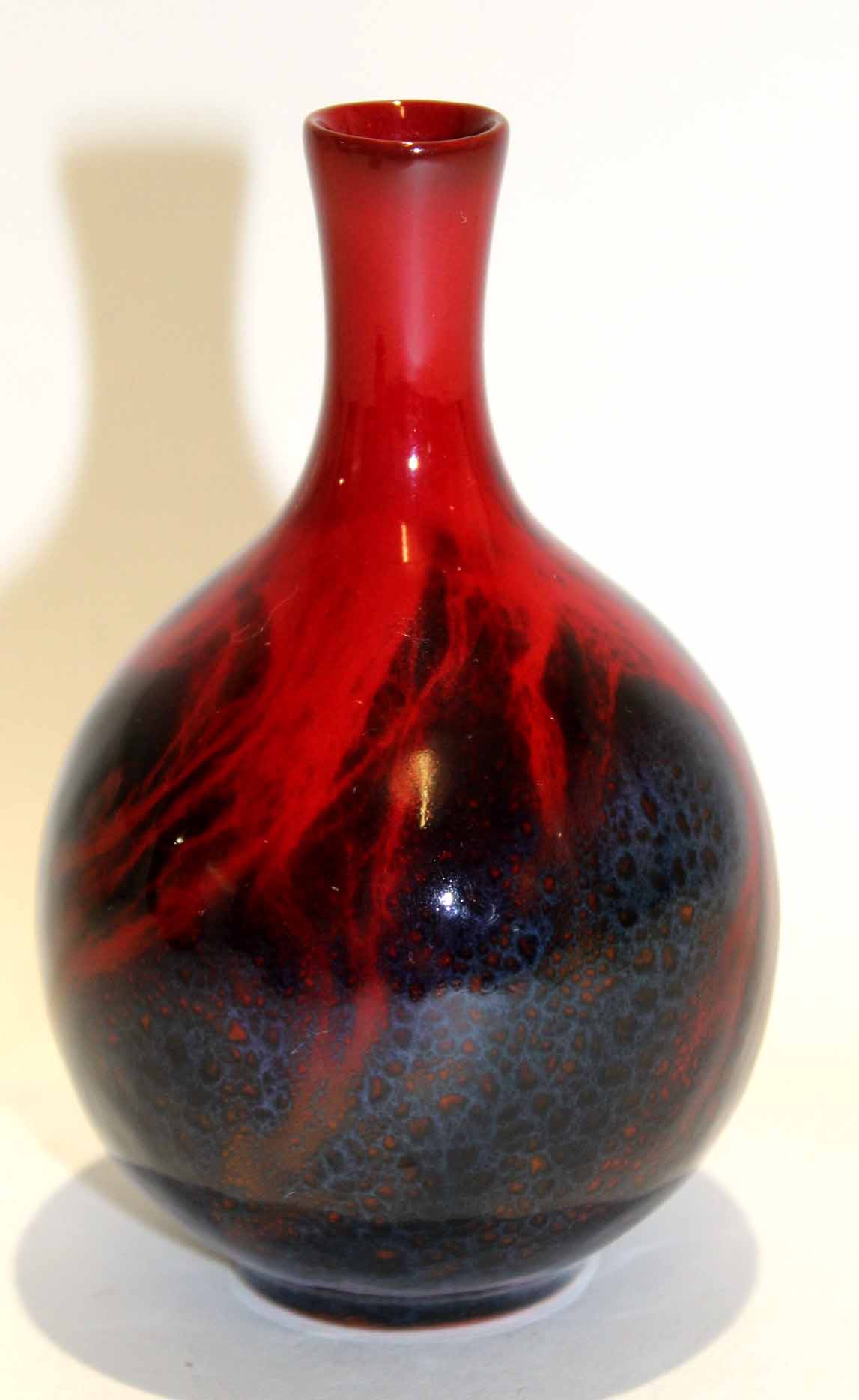 Small Doulton baluster flambe vase with a typical design, 7cm high