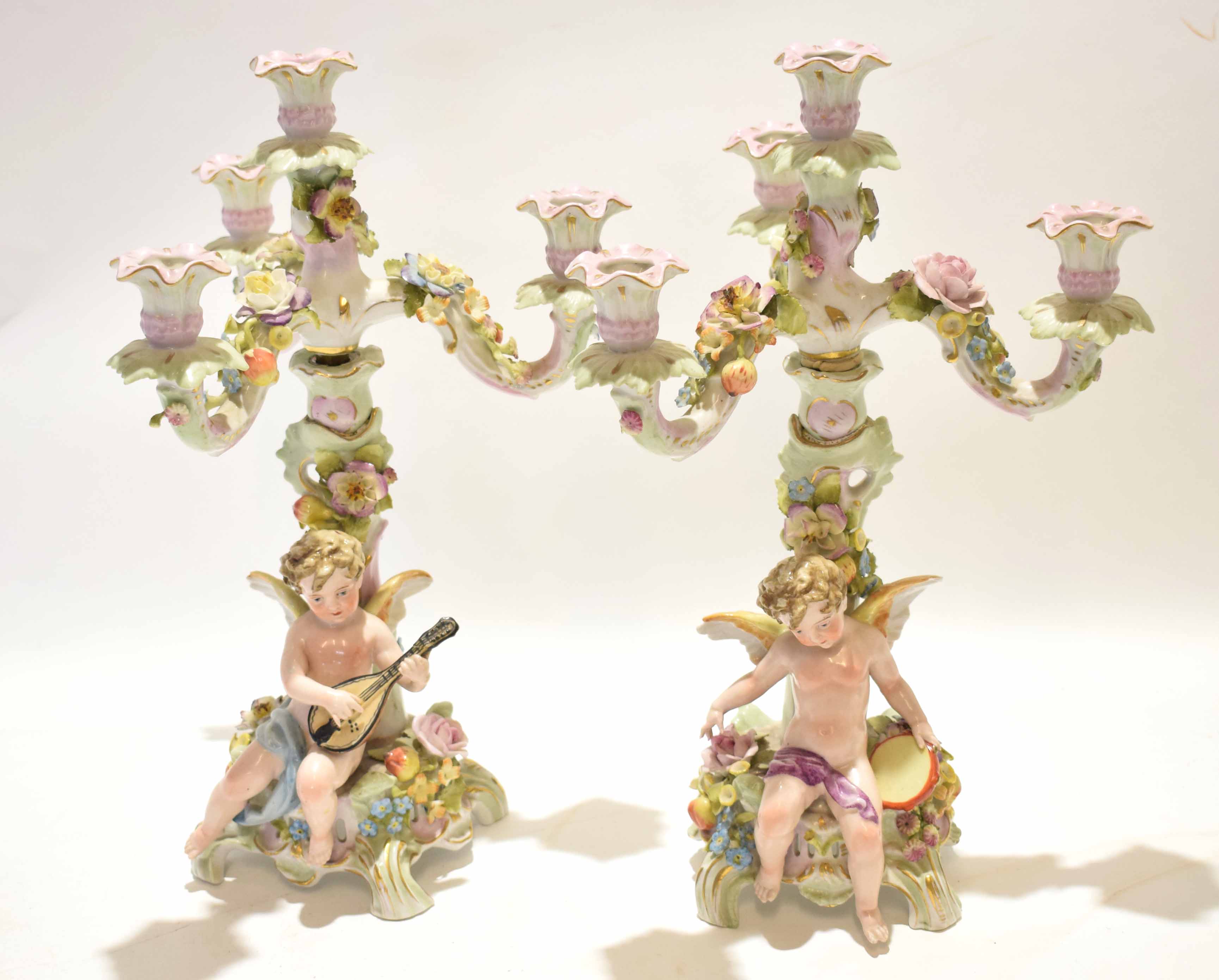 Pair of early 20th century Continental candelabra with flower encrusted decoration with mounted