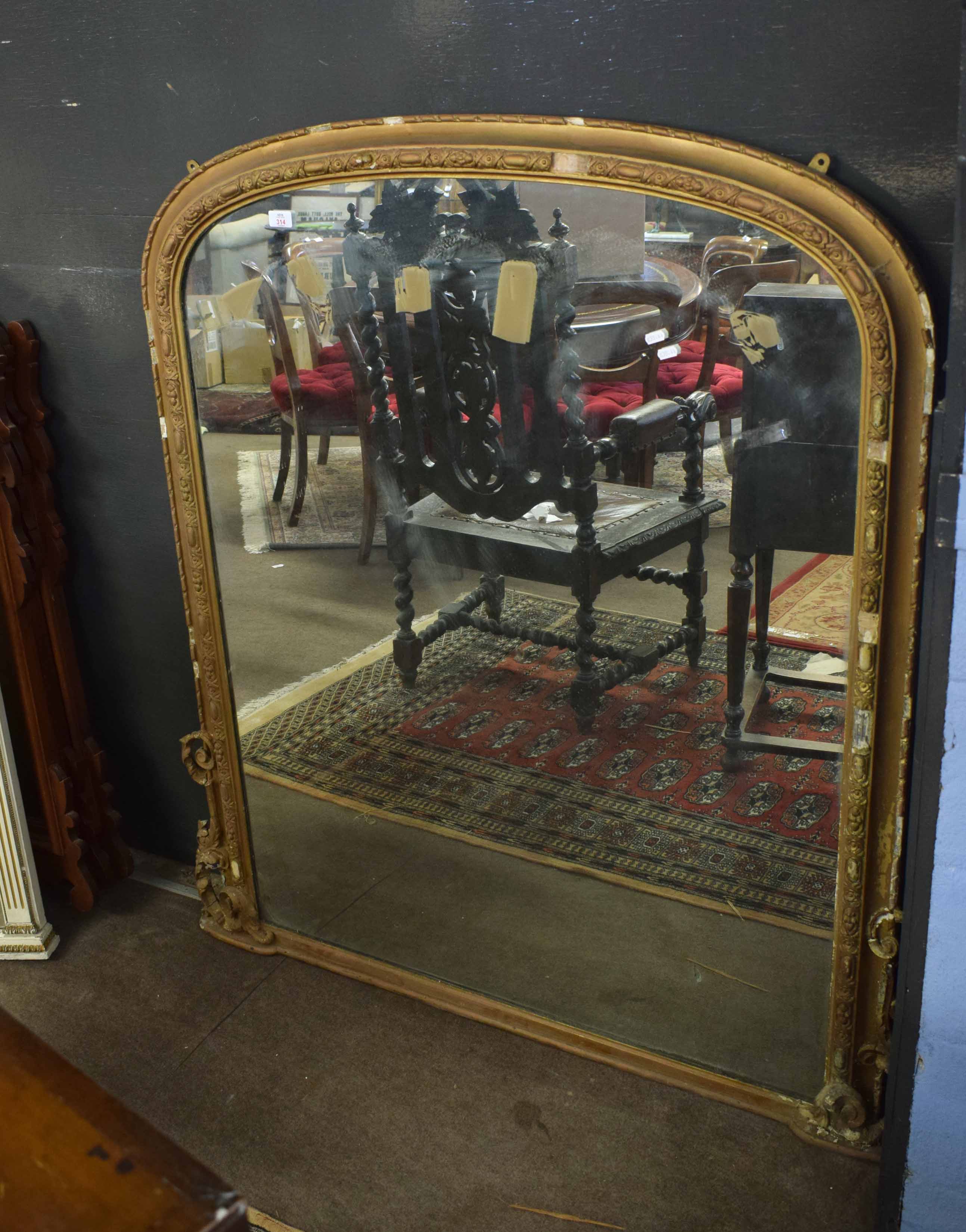 19th century gilt and gesso overmantel mirror, with an arched top and scroll to base, 127cm wide x