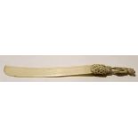 Large ivory model of a sword with carved hilt and man above, 36cm long