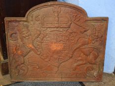 Reproduction cast iron fire back with raised armorial showing the date 1635, 59cm wide x 52cm tall