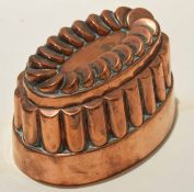 Victorian copper oval jelly or blancmange mould, stamped 106 beneath an orb and cross, 16cm x 11cm