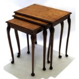 Early 20th century walnut set of three nesting tables with carved shell knuckles, raised on pad