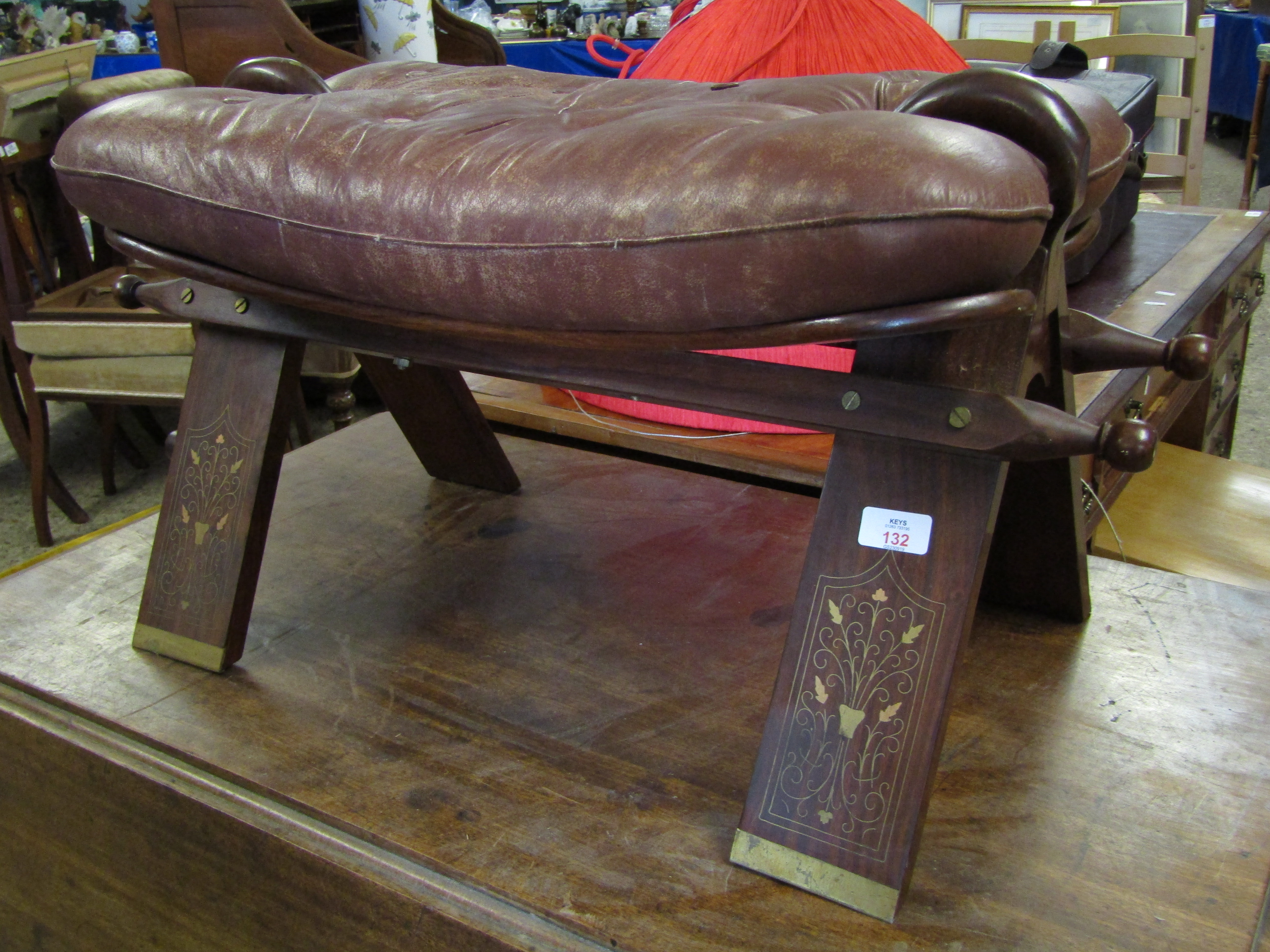 EASTERN HARDWOOD LEATHER TOP AND BRASS INLAID CAMEL STOOL