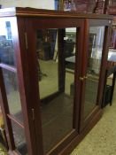 MAHOGANY FRAMED MIRRORED BACK TWO-DOOR BOOKCASE