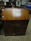 OAK EFFECT BUREAU WITH DROP FRONT WITH SINGLE DRAWER OVER TWO PANELLED CUPBOARD DOORS