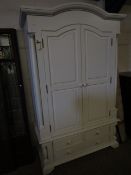 WHITE PAINTED ARCH TOP WARDROBE WITH TWO DOORS OVER THREE DRAWERS WITH TURNED KNOB HANDLES