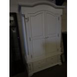 WHITE PAINTED ARCH TOP WARDROBE WITH TWO DOORS OVER THREE DRAWERS WITH TURNED KNOB HANDLES