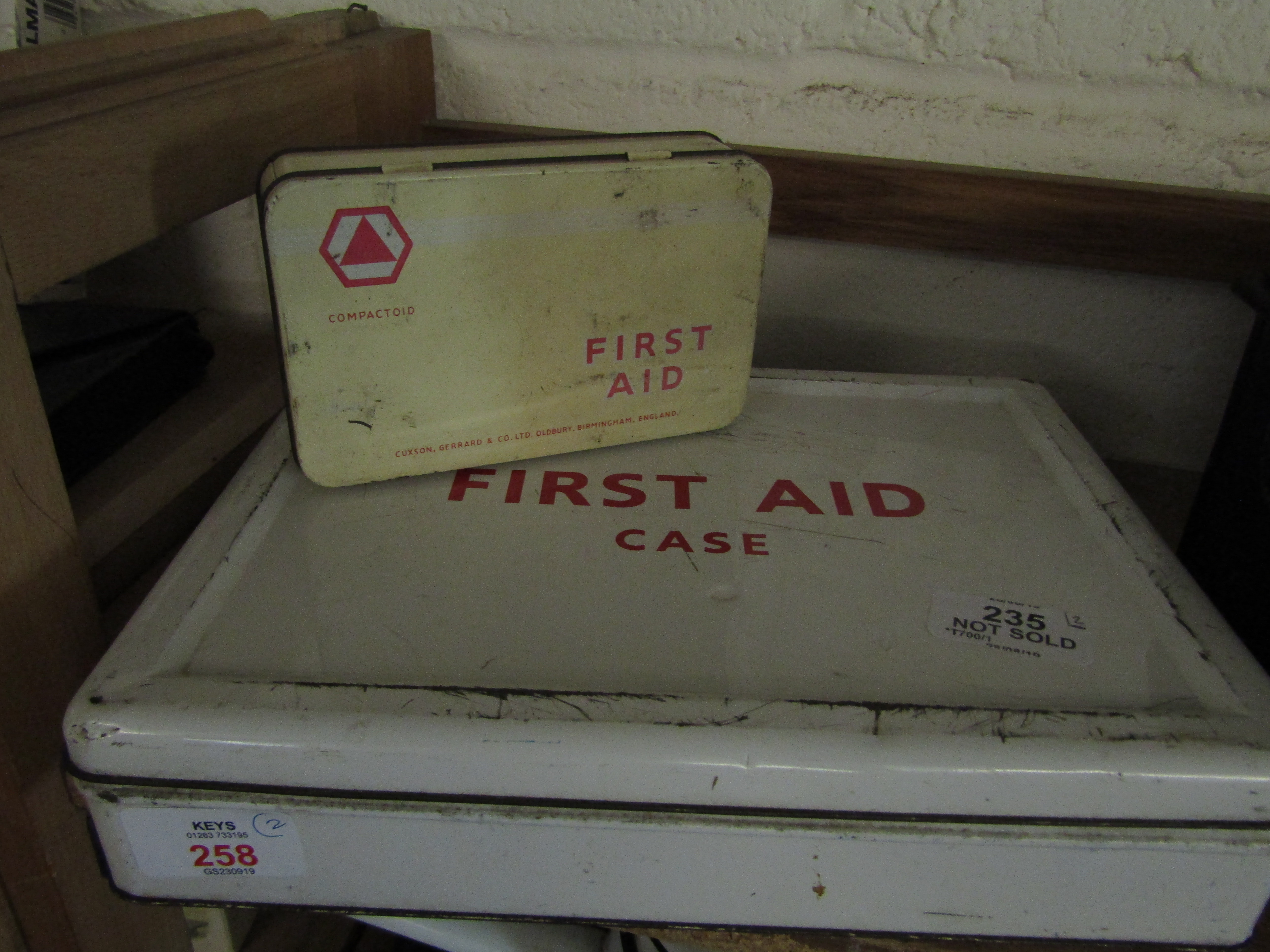 VINTAGE FIRST AID CASE AND TIN BOTH CONTAINING ORIGINAL CONTENTS, 28 AND 14CM LONG (2)