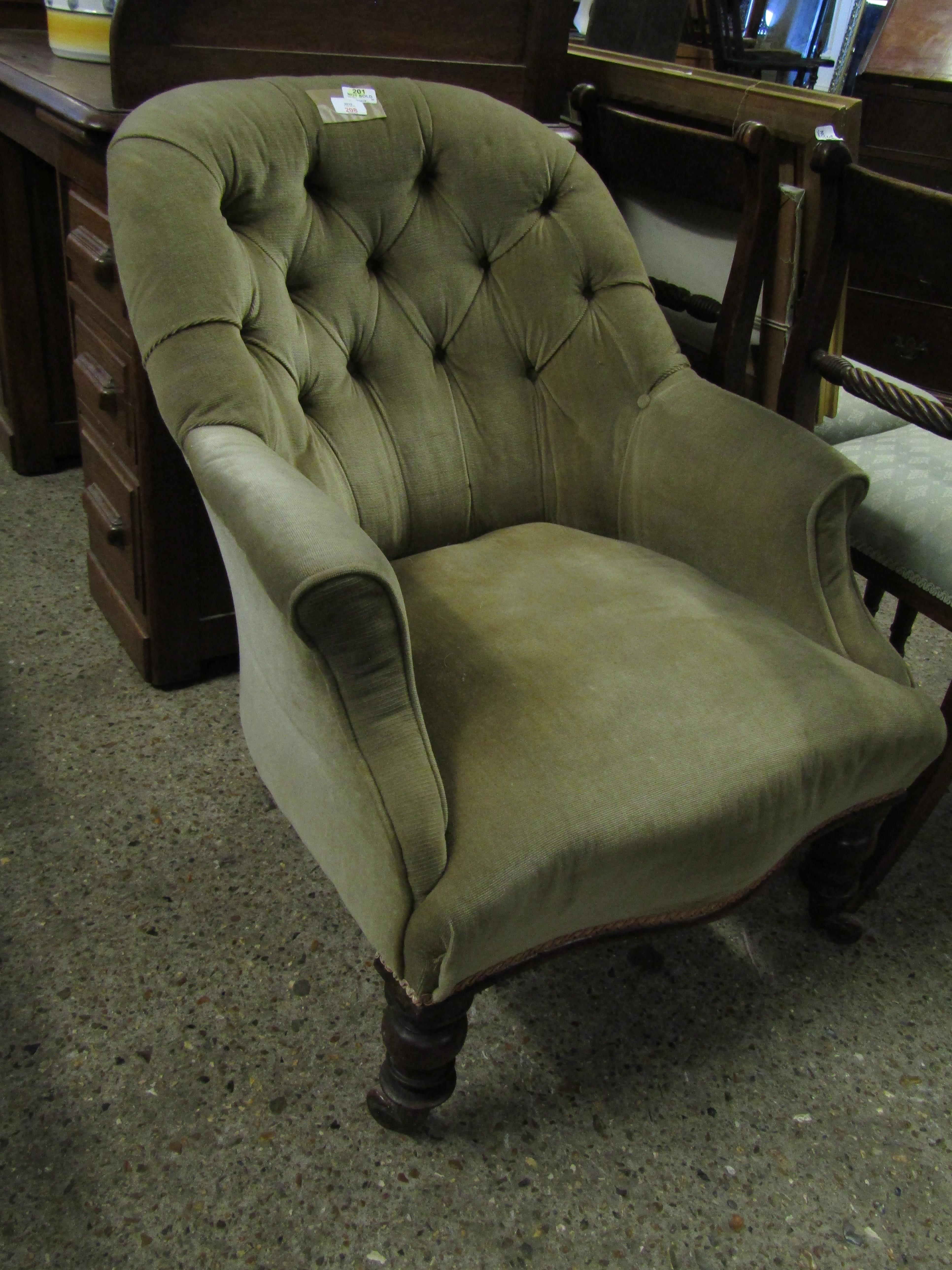 VICTORIAN MUSHROOM UPHOLSTERED BUTTON BACK ARMCHAIR WITH TURNED FRONT LEGS AND RAISED ON PORCELAIN
