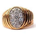 Gents oval diamond cluster ring with textured and chased descending box shoulders, stamped 14K, size