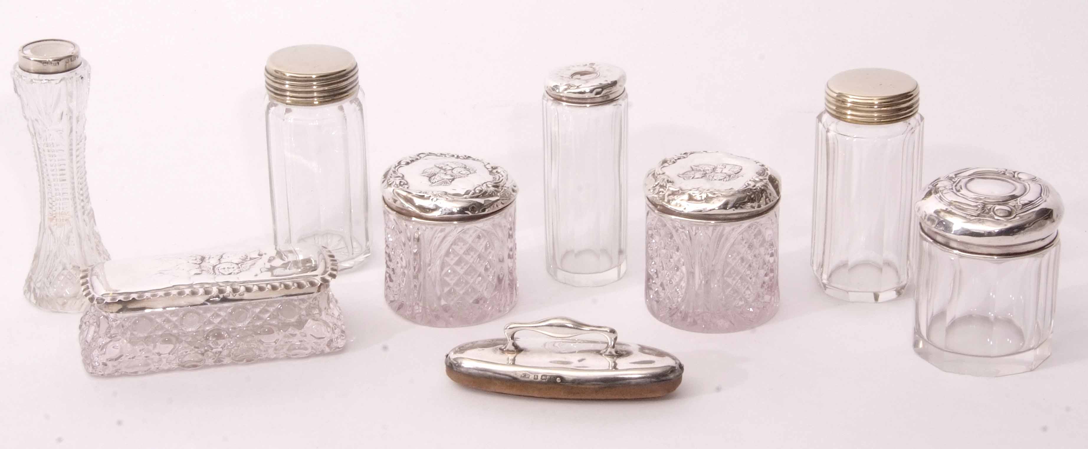 Mixed Lot: comprising four various silver lidded cylindrical toiletry jars, all with embossed - Image 2 of 2