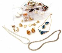 Plastic container of mainly earrings, necklaces etc