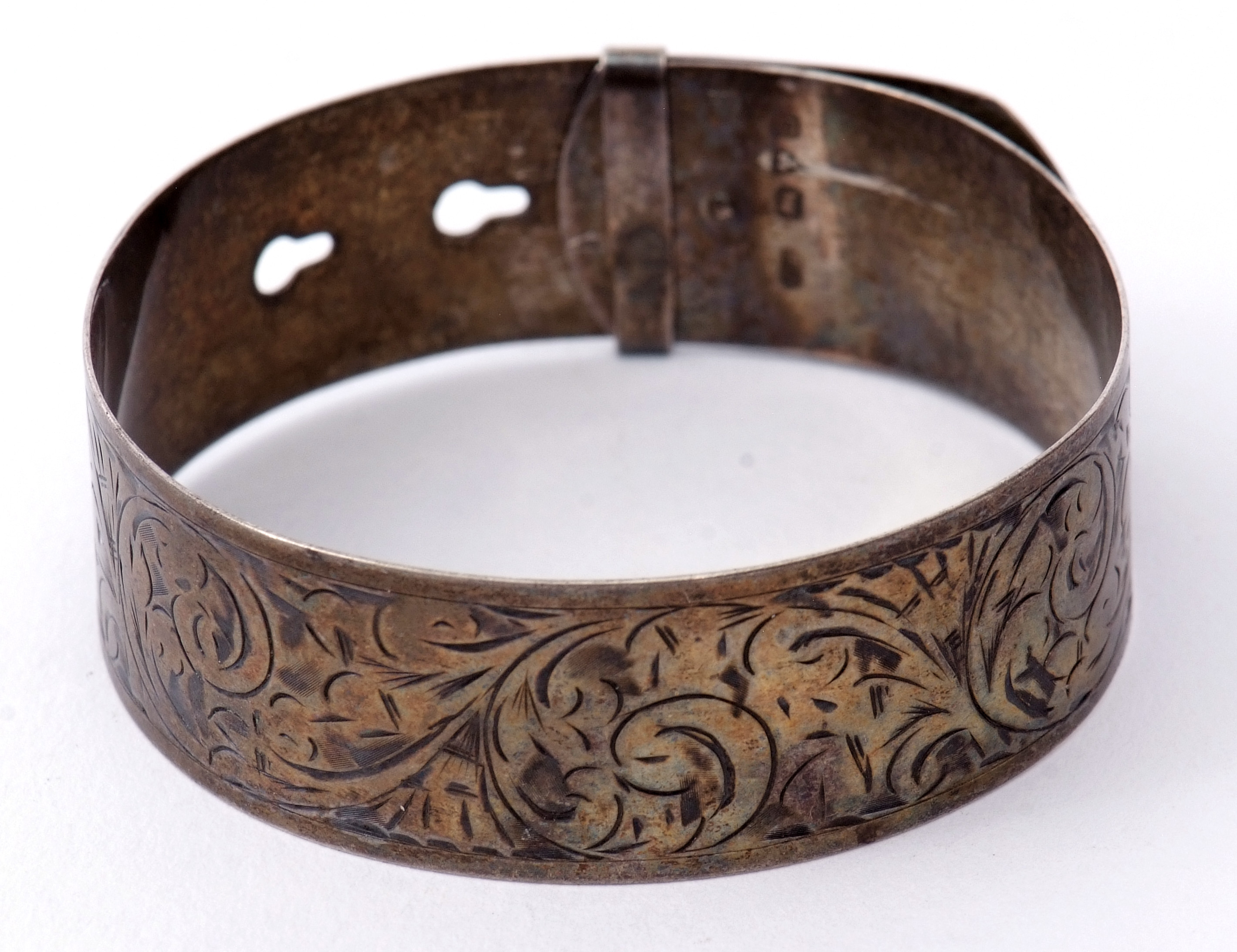 Hallmarked silver belt design bangle, chased and engraved with a foliate design, hallmarked Chester, - Image 3 of 4