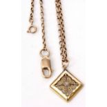 A 585 stamped square shaped pendant of pierced scroll design with a central cabochon stone, 1.