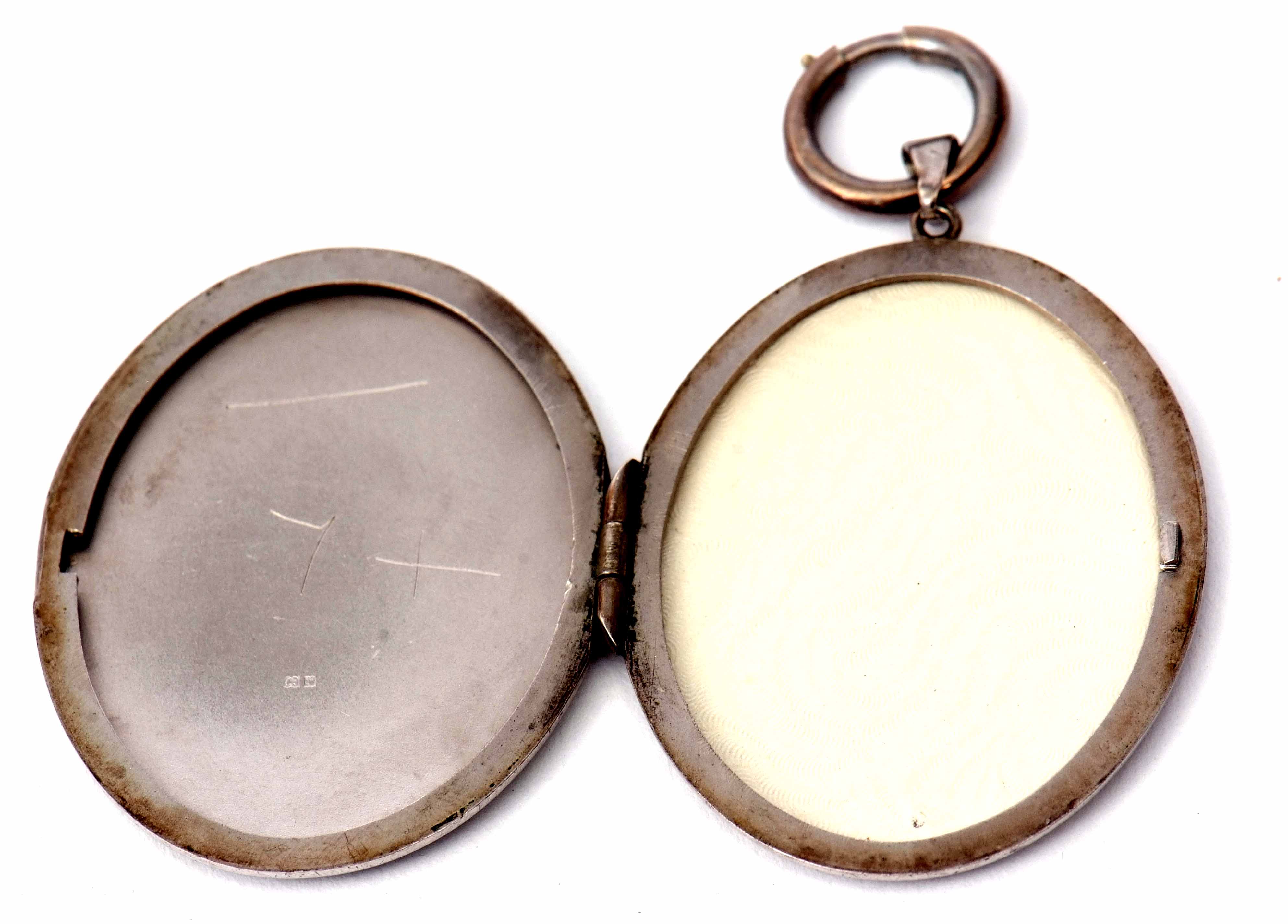 Hallmarked silver large oval locket chased and engraved with a foliate design, verso plain polished, - Image 2 of 2