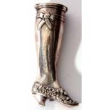 Continental white metal pill canister modelled in the form of a lady's right leg with floral