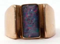 A 9ct stamped opal ring, a stylised design featuring a bezel set rectangular shaped cabochon opal (