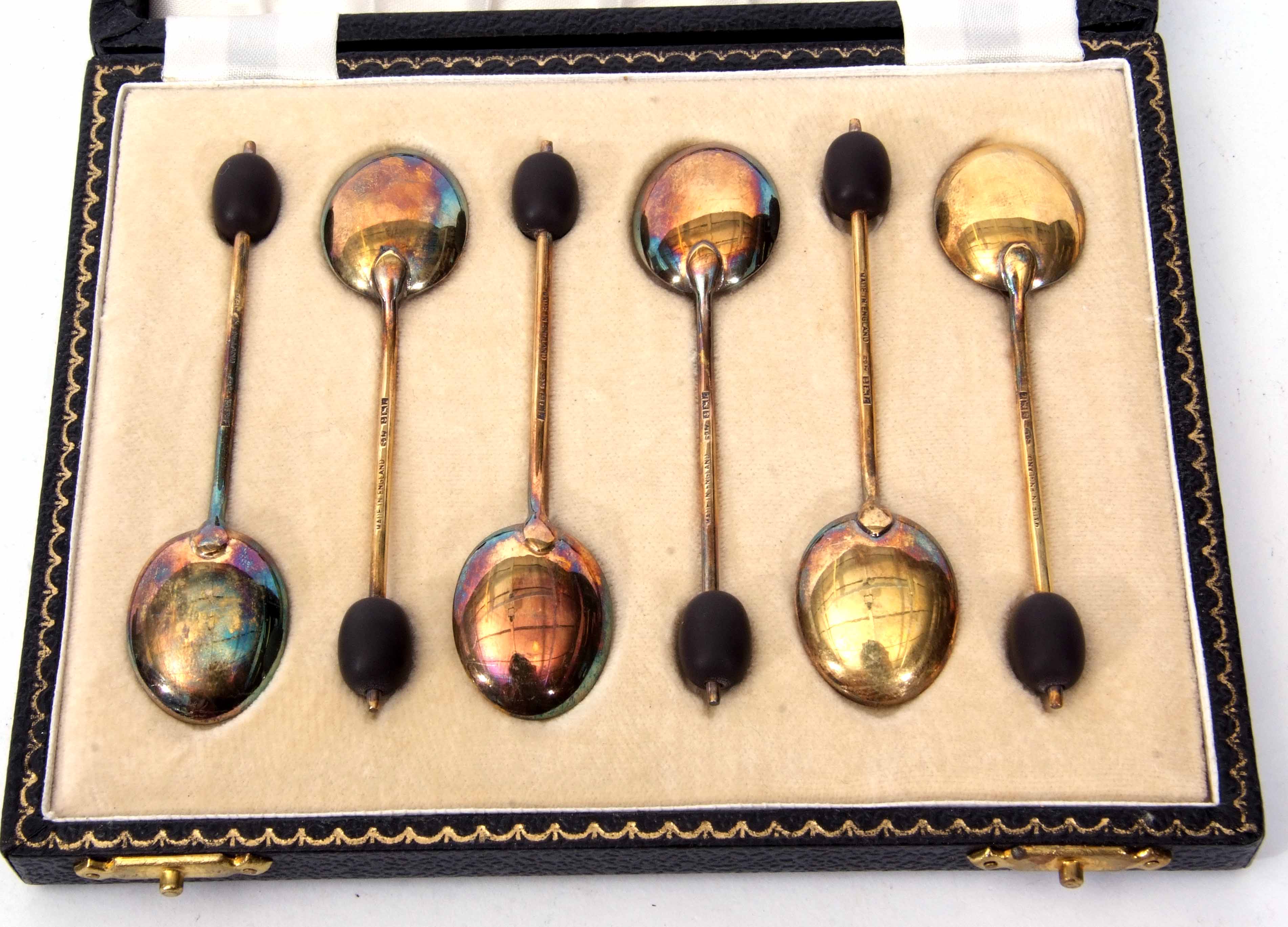 Cased set of six Elizabeth II silver gilt and enamelled coffee spoons, each with coffee bean finials - Image 3 of 3