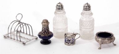 Mixed Lot: comprising two various early 19th century silver lidded cruet bottles each with pierced