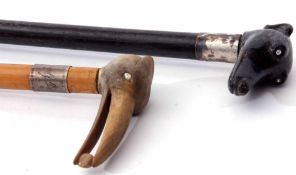 Mixed Lot: comprising two various walking canes, the first with ebonised shaft to a white metal