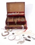 Red leatherette jewellery box to include a small quantity of costume jewellery, necklaces,