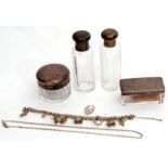 Mixed Lot: comprising four Continental white metal and clear glass toiletry bottles comprising three
