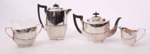 Early 20th century electro plated four piece tea set comprising hot water pot, tea pot, sugar