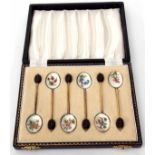 Cased set of six Elizabeth II silver gilt and enamelled coffee spoons, each with coffee bean finials