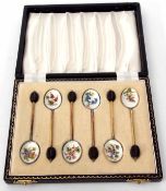 Cased set of six Elizabeth II silver gilt and enamelled coffee spoons, each with coffee bean finials