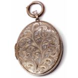 Hallmarked silver large oval locket chased and engraved with a foliate design, verso plain polished,