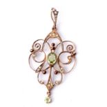 Edwardian 9ct seed pearl and peridot pendant featuring a central peridot and dropper, highlighted